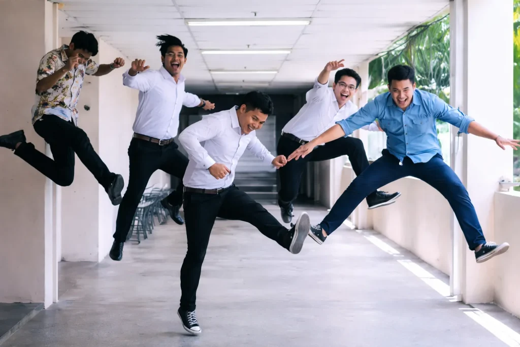 YOUR SUCCESS IS OUR SUCCESS! Joyful jump in the corridor